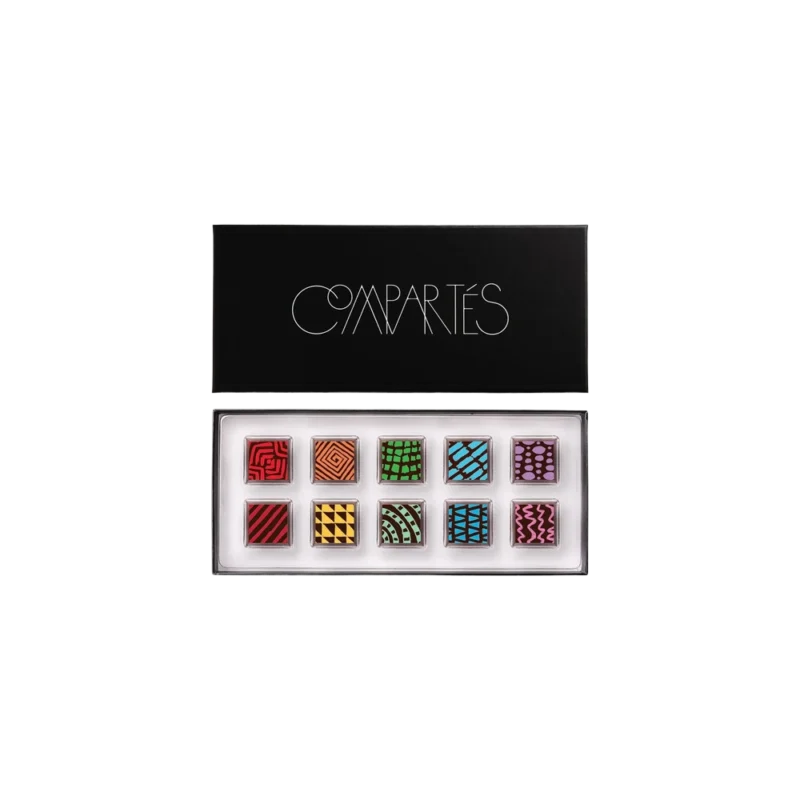 Compartés 10 Piece Signature Truffle Gift Box — artisan chocolate truffles in black gift box, ten square truffles with colorful geometric patterns arranged in rainbow order