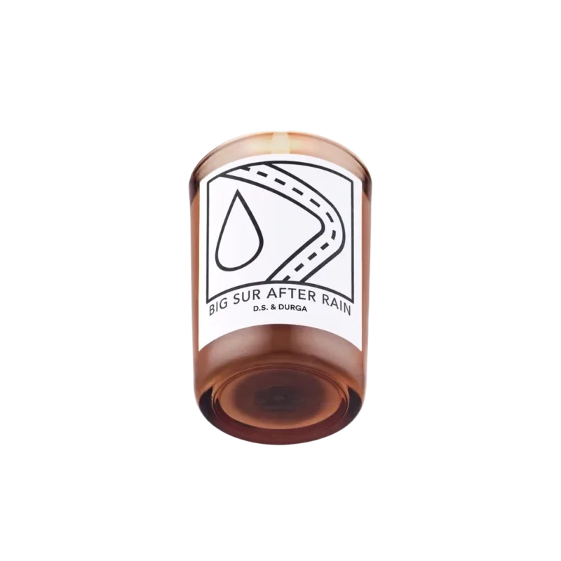 D.S. & Durga Big Sur After Rain Candle — amber glass votive with black-and-white road and raindrop label, soy-vegetable wax