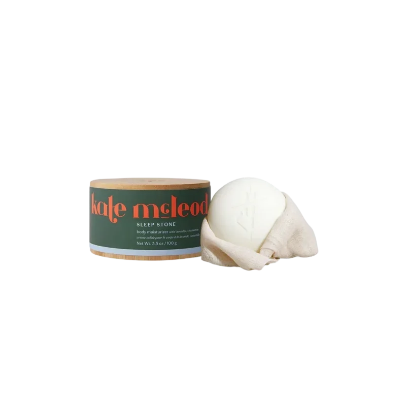 Kate McLeod Sleep Stone - solid body moisturizer, cream-colored lotion bar with bamboo canister and linen wrap