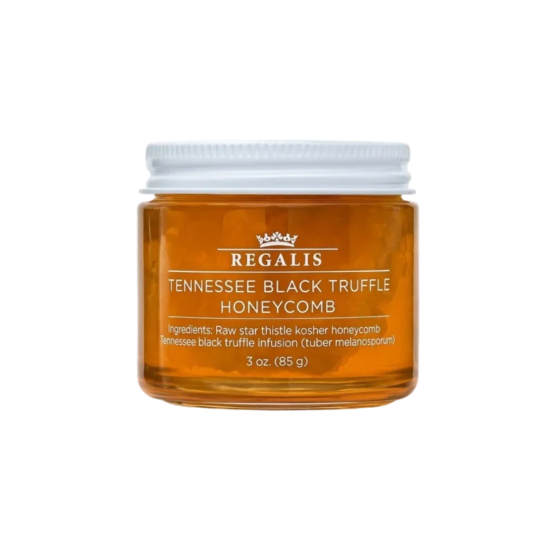 Regalis Tennessee Black Truffle Honeycomb - golden honey jar with visible honeycomb, black truffle infusion, white lid on dark background