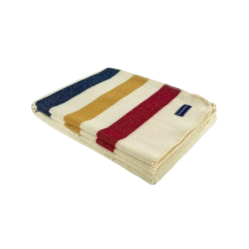 Faribault Mill Frontier Wool Throw – striped wool blanket with red, golden yellow, and navy stripes on natural cream background, folded with blue Faribault Mill label visible